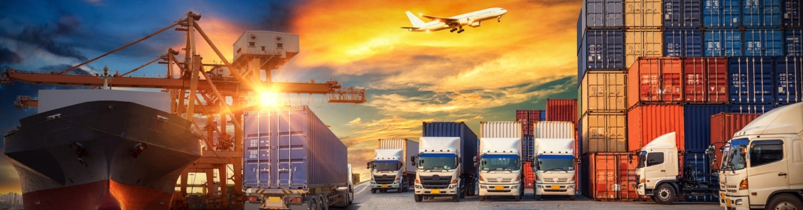 Image of a shipping dock with containers, trucks and an airplane in the sky